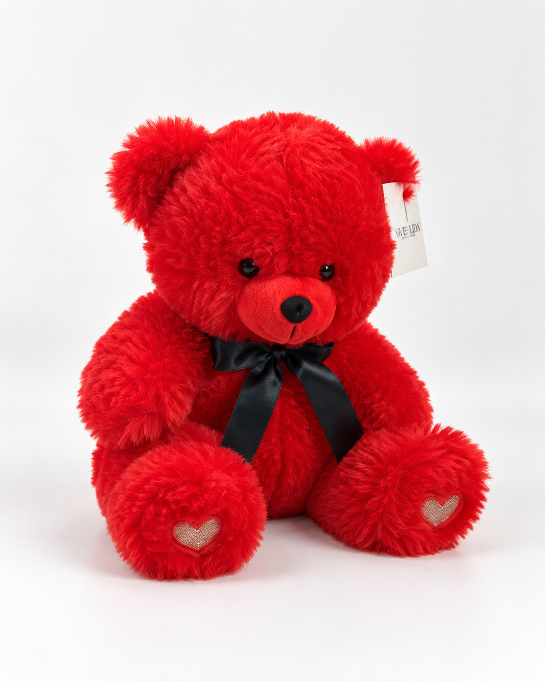 Ourson en peluche rouge PETIT CŒUR assis, nœud noir et cœurs sous les pattes